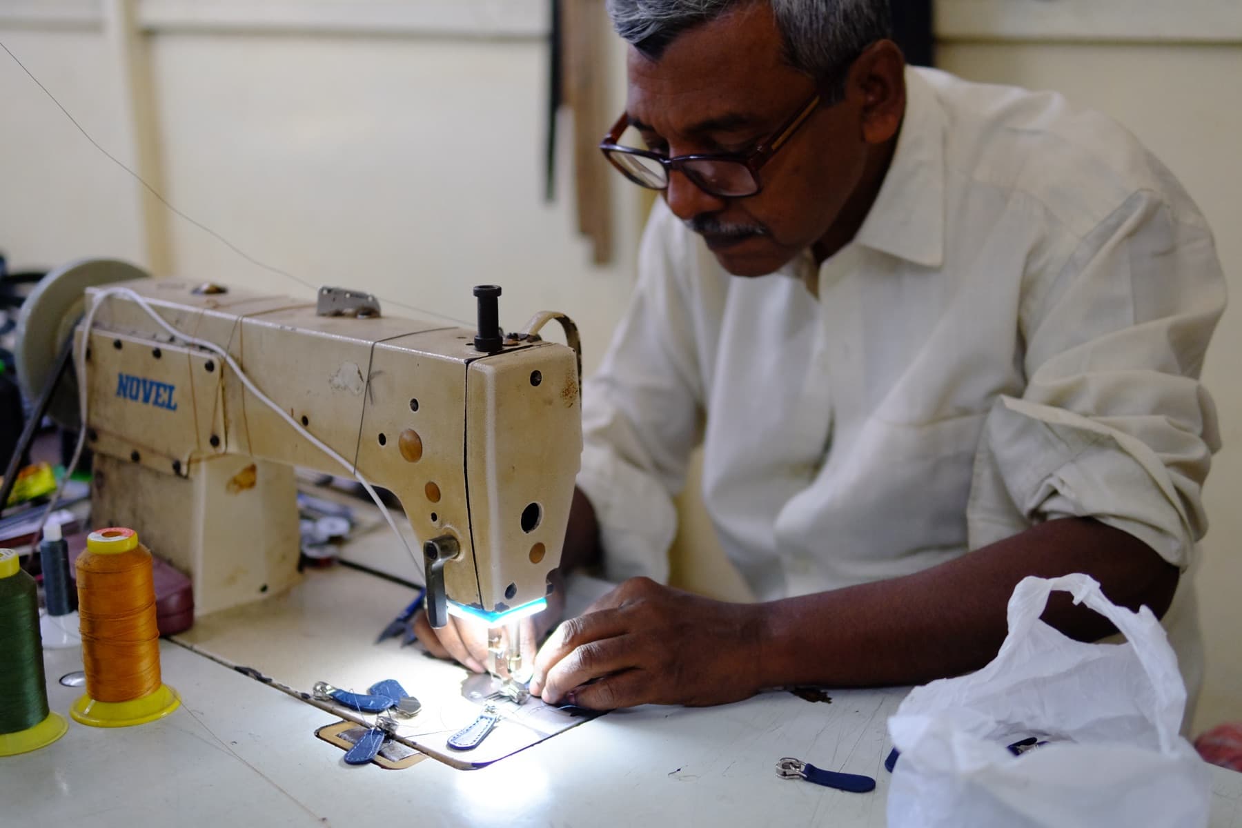 Artisan hand-stitching premium leather